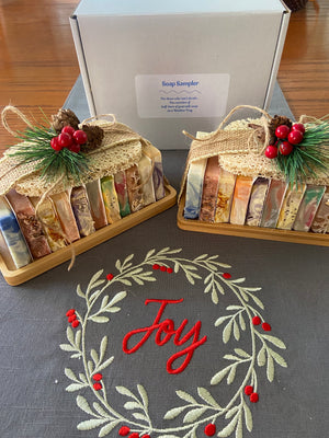 Soap Sampler contains 11 half bars of goat milk soap and a soap saver on a bamboo tray.  For those who can't decide!