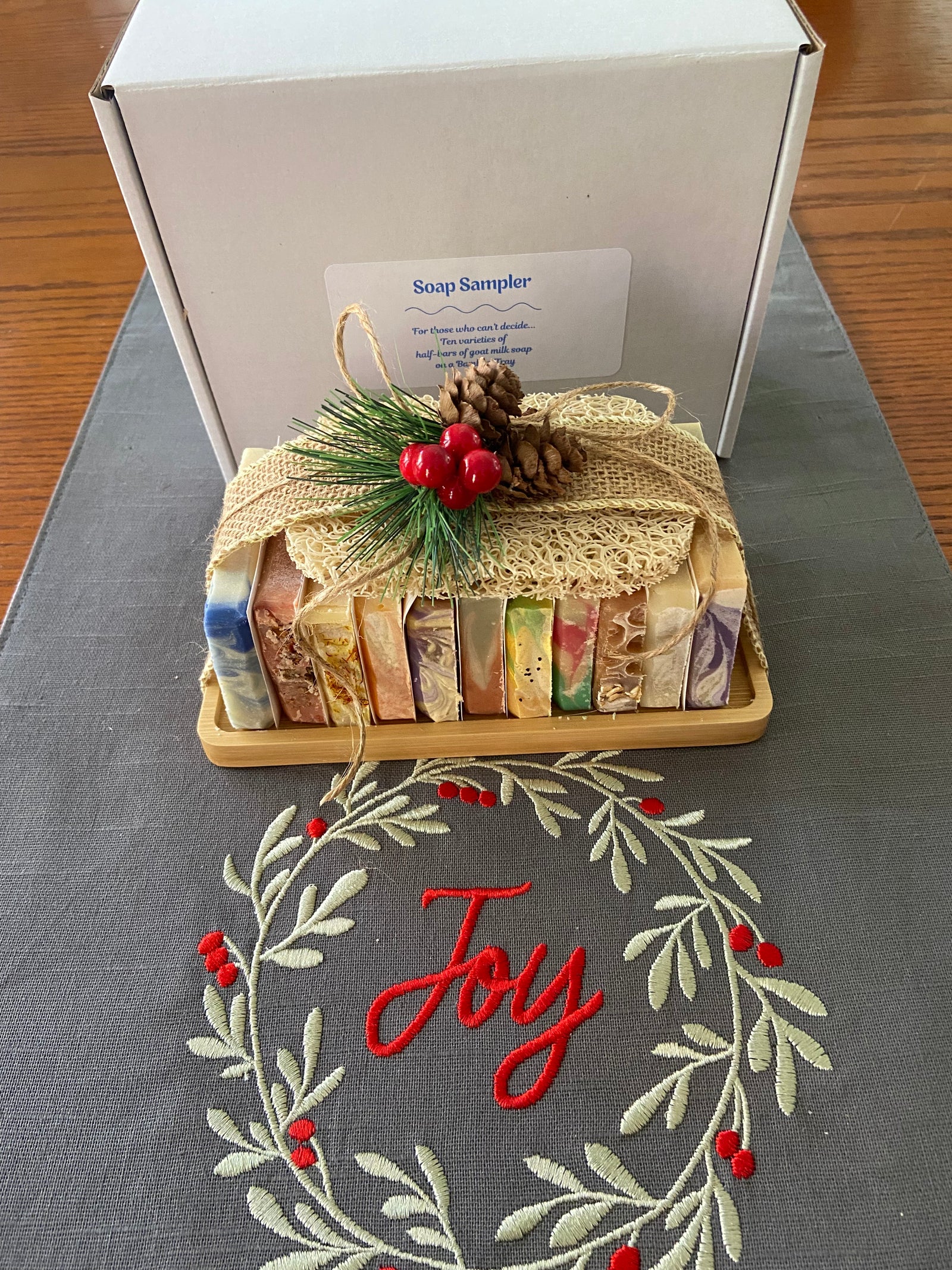 Soap Sampler contains 11 half bars of goat milk soap and a soap saver on a bamboo tray.  For those who can't decide!